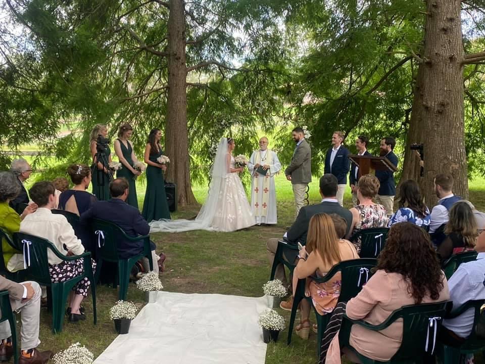 Wedding ceremony in the redwood forest at Unwind Escapes Dooralong Valley