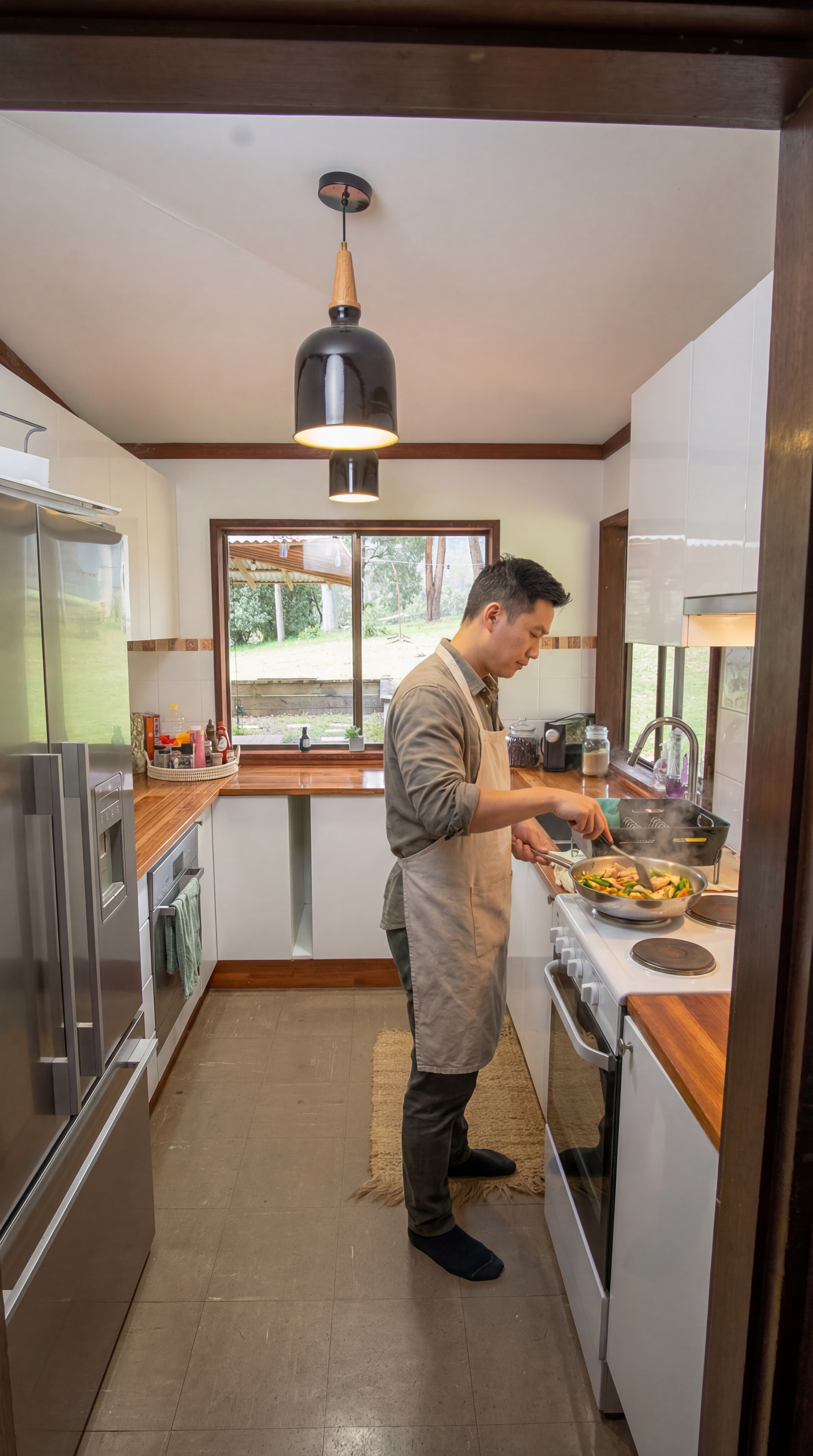 Fully equipped shared kitchen — oven, stovetop, microwave, fridge, and utensils