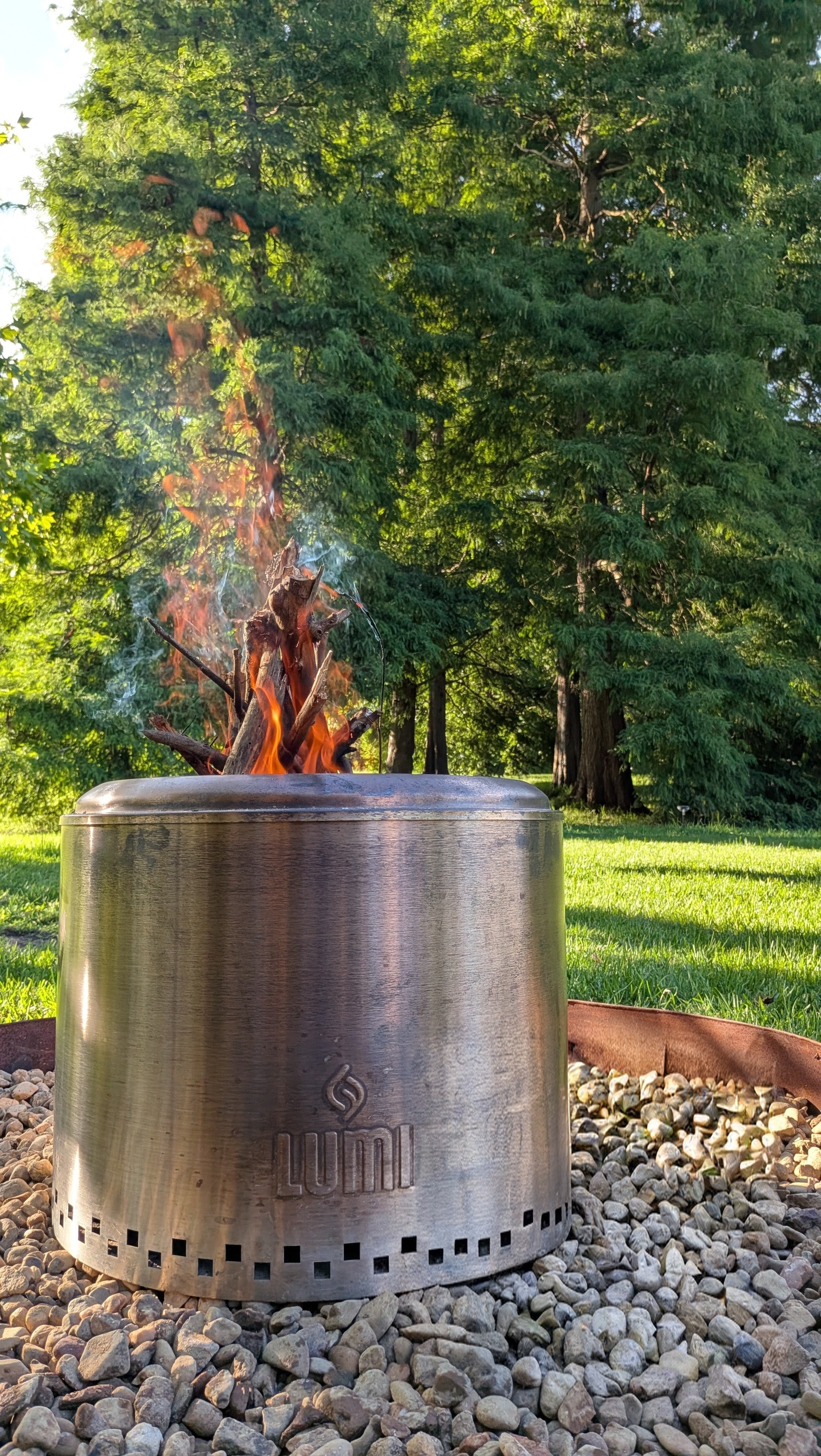 Close-up of the private fire pit with the dawn redwood grove behind