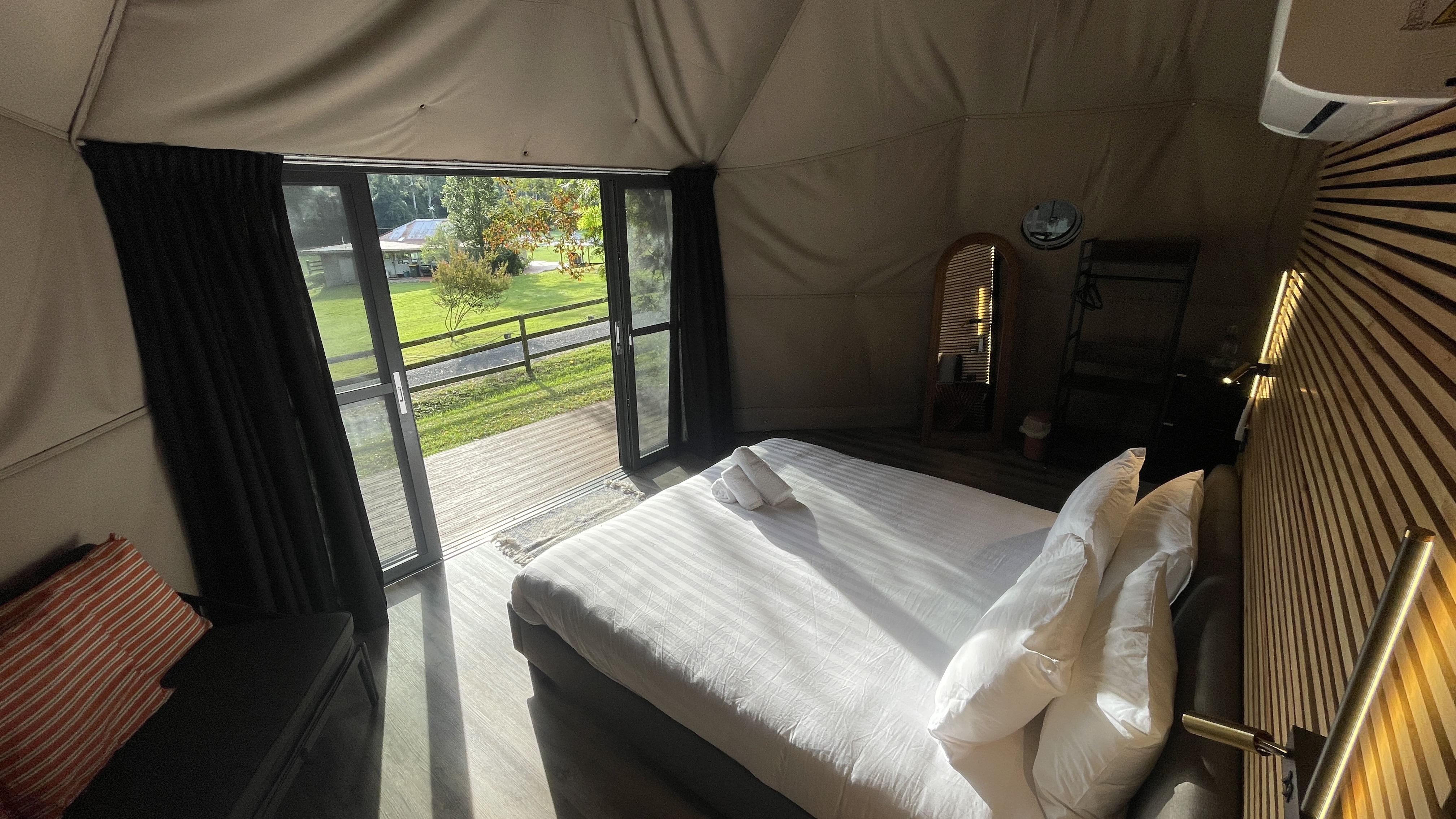 View from the king bed looking out through the glass doors