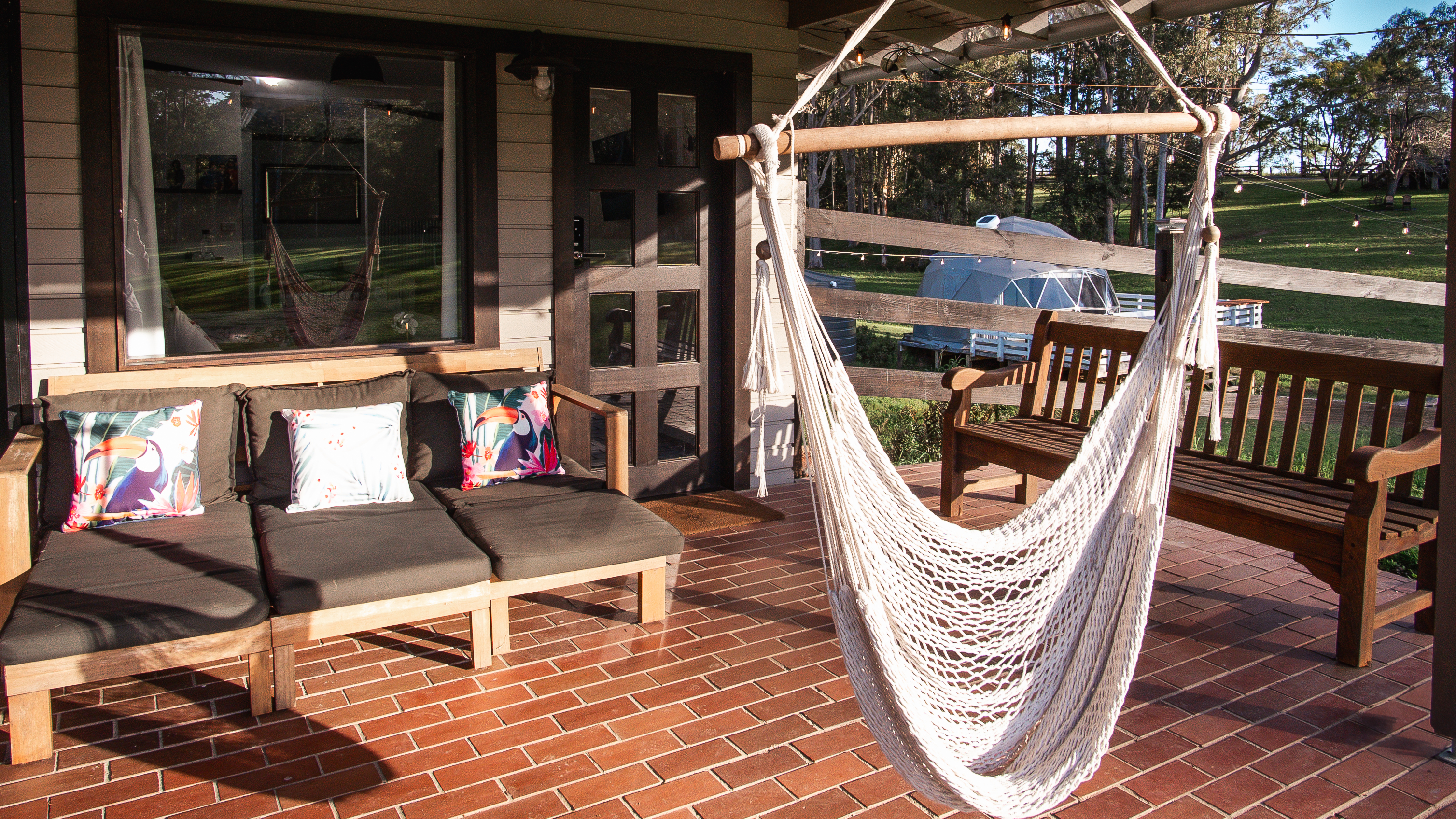Private entrance with hammock chair on the covered balcony